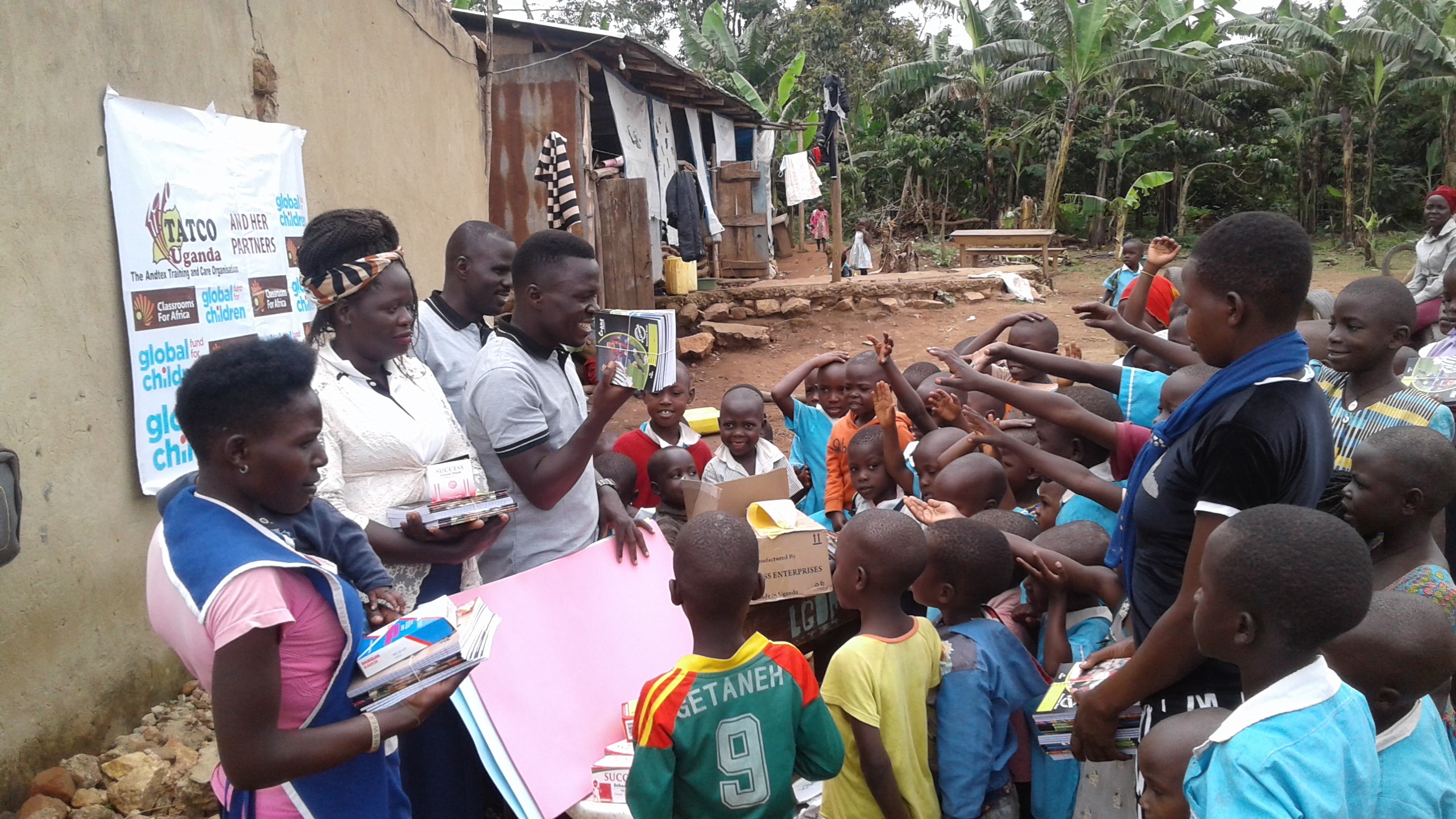 TATCO Uganda and partners distributing scholastic materials in the community